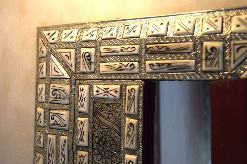 Amazingly detailed metal and bone mirror