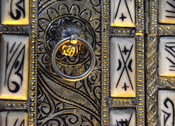 Amazingly detailed metal and bone mirror