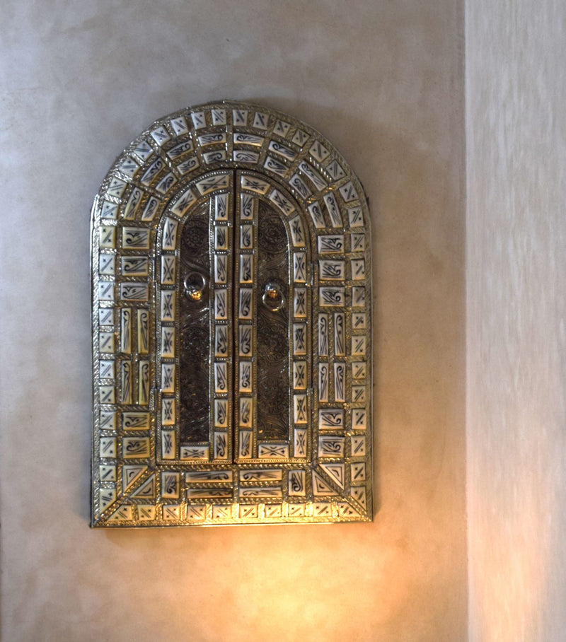 Amazingly detailed metal and bone mirror