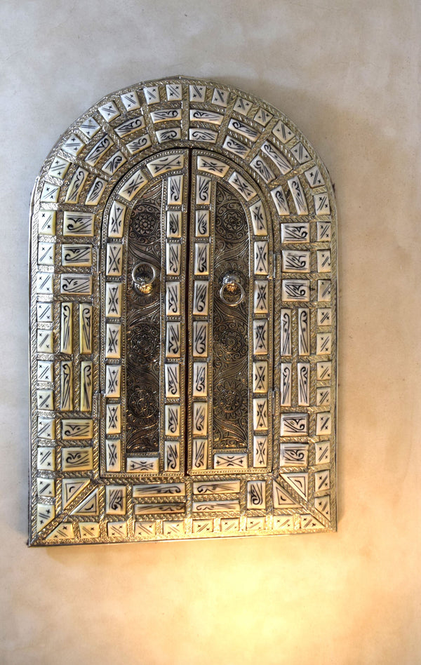 Amazingly detailed metal and bone mirror