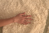 Minimalistic Beni Ouarin rug – olive green design on a cream background