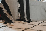 Minimalistic Beni Ouarin runner - black design on a cream background