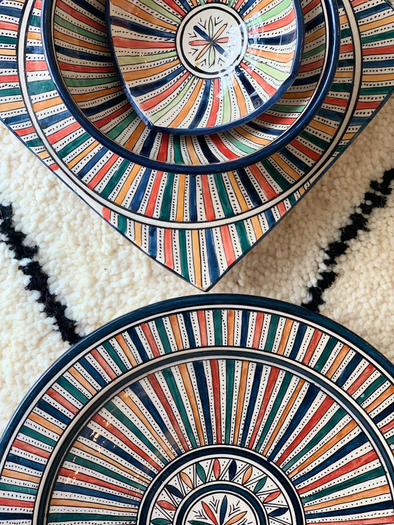 A set of two multi-coloured bowls and two plates