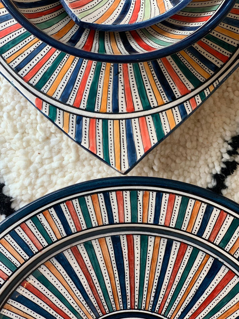 A set of two multi-coloured bowls and two plates